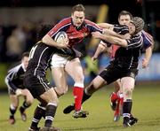 27 February 2004; Jason Jones Hughes of Munster is tackled by Elvis Seveali'i of Neath Swansea Ospreys during the Celtic League match between Munster and Neath Swansea Ospreys at Musgrave Park in Cork. Photo by Damien Eagers/Sportsfile