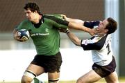 28 February 2004; Mike McCarthy of Connacht is tackled by Graham Morrison of Glasgow Rugby during the Celtic League match between Connacht and Glasgow Rugby at The Sportsground in Galway. Photo by Ray Ryan/Sportsfile