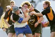 28 February 2004; Denis Fogarty of Cork Constitution is tackled by Colin Finnerty and William Wallace of Buccaneers during the AIB All-Ireland League Division 1 match between Cork Constitution and Buccaneers at Temple Hill in Cork. Photo by Damien Eagers/Sportsfile