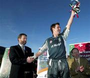 28 February 2004; Sligo IT captain Michael Moynes is presented with the cup by President of the GAA Sean Kelly after the Datapac Sigerson Cup Final match between Queens University Belfast and Sligo IT at Corrigan Park in Belfast, Antrim. Photo by SportsfileUachtarán Chumann Lúthchleas Gael John Horan