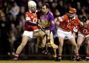 28 February 2004; Darragh Ryan of Wexford in action against Timmy McCarthy, left, and Sean McGrath of Cork during the Allianz Hurling League Division 1B match between Cork and Wexford at Páirc Uí Rinn in Cork. Photo by Damien Eagers/Sportsfile