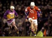 28 February 2004; Timmy McCarthy of Cork in action against Paul Codd of Wexford during the Allianz Hurling League Division 1B match between Cork and Wexford at Páirc Uí Rinn in Cork. Photo by Damien Eagers/Sportsfile