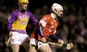 28 February 2004; Timmy McCarthy of Cork in action against Mick O'Leary of Wexford during the Allianz Hurling League Division 1B match between Cork and Wexford at Páirc Uí Rinn in Cork. Photo by Damien Eagers/Sportsfile
