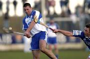 29 February 2004; Dan Shanahan of Waterford in action against Cyril Cuddy of Laois during the Allianz Hurling League Division 1A match between Waterford and Laois at Walsh Park in Waterford. Photo by Matt Browne/Sportsfile
