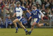 29 February 2004; John Mullane of Waterford in action against James Walsh of Laois during the Allianz Hurling League Division 1A match between Waterford and Laois at Walsh Park in Waterford. Photo by Matt Browne/Sportsfile