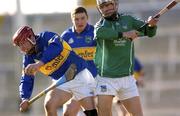 29 February 2004; John Devane of Tipperary in action against James O'Brien of Limerick during the Allianz Hurling League Division 1B match between Limerick and Tipperary at the Gaelic Grounds in Limerick. Photo by Damien Eagers/Sportsfile