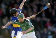 29 February 2004; Andrew O'Shaughnessy of Limerick in action against David Kennedy of Tipperary during the Allianz Hurling League Division 1B match between Limerick and Tipperary at the Gaelic Grounds in Limerick. Photo by Damien Eagers/Sportsfile