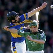 29 February 2004; Andrew O'Shaughnessy of Limerick in action against David Kennedy of Tipperary during the Allianz Hurling League Division 1B match between Limerick and Tipperary at the Gaelic Grounds in Limerick. Photo by Damien Eagers/Sportsfile