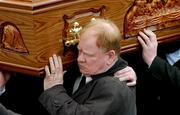 5 March 2005; Brendan McAnallen carries his son's coffin during the funeral of Tyrone footballer Cormac McAnallen at St Patrick's Church in Eglish, Tyrone. Photo by Ray McManus/Sportsfile