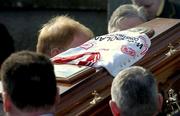 5 March 2005; A Tyrone jersey is seen draped on the coffin at the funeral of Tyrone footballer Cormac McAnallen at St Patrick's Church in Eglish, Tyrone. Photo by Ray McManus/Sportsfile