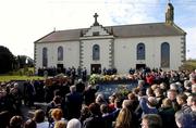5 March 2005; The coffin is carried to the church during the funeral of Tyrone footballer Cormac McAnallen at St Patrick's Church in Eglish, Tyrone. Photo by Ray McManus/Sportsfile