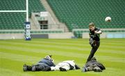 5 March 2004; Out-half Ronan O'Gara takes a kick at goal as he has his photo taken by photographers during Ireland Rugby kicking practice at Twickenham Stadium in London, England. Photo by Brendan Moran/Sportsfile