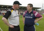 10 June 2006; Kilkenny manager Brian Cody in conversation with Westmeath manager Seamus Qualter, right, before the game. Guinness Leinster Senior Hurling Championship, Semi-Final, Westmeath v Kilkenny, Cusack Park, Mullingar, Co. Westmeath. Picture credit: Pat Murphy / SPORTSFILE
