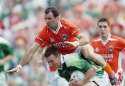 11 June 2006; Shane Goan, Fermanagh, in action against Steven McDonnell, Armagh. Bank of Ireland Ulster Senior Football Championship, Semi-Final, Armagh v Fermanagh, St. Tighernach's Park, Clones, Co. Monaghan. Picture credit: David Maher / SPORTSFILE