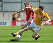 11 June 2006; Gerard McGarvey, Armagh, in action against Sean Burke, Antrim. E.S.B Ulster Minor Football Championship, Semi-Final, Armagh v Antrim, St. Tighernach's Park, Clones, Co. Monaghan. Picture credit: Oliver McVeigh / SPORTSFILE