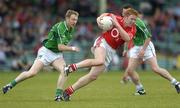 11 June 2006; Sean Levis, Cork, in action against Micheal Reidy, Limerick. Bank of Ireland Munster Senior Football Championship, Semi-Final, Limerick v Cork, Gaelic Grounds, Limerick. Picture credit: Brian Lawless / SPORTSFILE