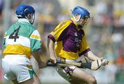 11 June 2006; Michael Jordan, Wexford, in action against David Franks, Offaly. Guinness Leinster Senior Hurling Championship, Semi-Final, Offaly v Wexford, Nowlan Park, Kilkenny. Picture credit: Aoife Rice / SPORTSFILE