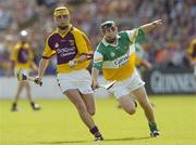 11 June 2006; Eoin Quigley, Wexford, in action against David Franks, Offaly. Guinness Leinster Senior Hurling Championship, Semi-Final, Offaly v Wexford, Nowlan Park, Kilkenny. Picture credit: Damien Eagers / SPORTSFILE