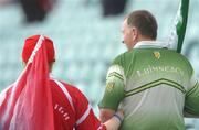 11 June 2006; A Cork and a Limerick fan make their way to their seats. Bank of Ireland Munster Senior Football Championship, Semi-Final, Limerick v Cork, Gaelic Grounds, Limerick. Picture credit: Brian Lawless / SPORTSFILE