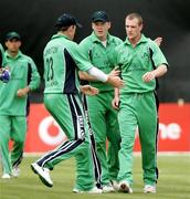 13 June 2006; Trent Johnston congratulates John Mooney after the wicket of England captain Andrew Strauss. Vodafone One Day International, Ireland v England, Stormont, Belfast, Co. Antrim. Picture credit; Oliver McVeigh / SPORTSFILE