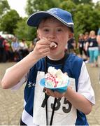 13 June 2014; Team Leinster athlete Dylan Dwyer, age 11, from Shinrone, Co. Offaly, enjoys some ice-cream at the UL Sport Arena. Special Olympics Ireland Games, University of Limerick, Limerick. Picture credit: Diarmuid Greene / SPORTSFILE