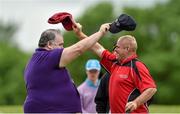 14 June 2014; Athlete Anthony McGrath, Kilmedan, Co. Waterford, Team Munster, swaps hats following the Short Putt event with volunteer David Rofe, Newmarket-on-Fergus, Co. Clare. Special Olympics Ireland Games, Ballykisteen Hotel & Golf Resort, Co. Tipperary. Picture credit: Diarmuid Greene / SPORTSFILE