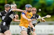 14 June 2014; Martin Coyle, Longford, in action against Jamie Kenny and Liam Reidy, Sligo. Nicky Rackard Cup Promotion Play-off, Sligo v Longford, Páirc Seán O'Heslin, Ballinamore, Co. Leitrim. Picture credit: Oliver McVeigh / SPORTSFILE