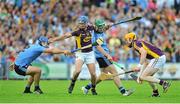 14 June 2014; Ian Byrne, left, and Podge Doran, Wexford, in action against Stephen Hiney, left, and Michael Carton, Dublin. Leinster GAA Hurling Senior Championship, Semi-Final, Wexford v Dublin, Wexford Park, Wexford. Picture credit: Dáire Brennan / SPORTSFILE
