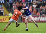 29 May 2016; Cian Mackey of Cavan in action against James Morgan of Armagh in the Ulster GAA Football Senior Championship quarter-final between Cavan and Armagh at Kingspan Breffni Park, Cavan. Photo by Oliver McVeigh/Sportsfile