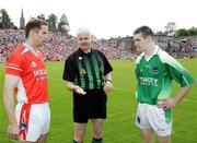 11 June 2006; Paul Mc Grane, Armagh, and Barry Owens, Fermanagh with Referee John Bannon. Bank of Ireland Ulster Senior Football Championship, Semi-Final, Armagh v Fermanagh, St. Tighernach's Park, Clones, Co. Monaghan. Picture credit: Oliver McVeigh / SPORTSFILE