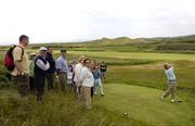 13 June 2006; The Gallery watches Darren Crowe, of Dunmurray, tee off from the 3rd during the quarter finals of the Irish Amateur Close Championship. European Club Golf Club, Brittas Bay, Co. Wicklow, Picture credit: Damien Eagers / SPORTSFILE