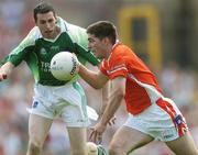 11 June 2006; Brian Mallon, Armagh, in action against Raymond Johnston, Fermanagh. Bank of Ireland Ulster Senior Football Championship, Semi-Final, Armagh v Fermanagh, St. Tighernach's Park, Clones, Co. Monaghan. Picture credit: David Maher / SPORTSFILE