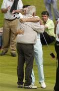 14 June 2006; Rory McIlroy, Holywood G.C., is congratulated by his father and caddy Gerry after he won the Irish Amateur Close Championship by 3 and 2 after a putt on the 16th green against Simon Ward, Co. Louth G.C., not pictured. European Club Golf Club, Brittas Bay, Co. Wicklow, Picture credit: Pat Murphy / SPORTSFILE