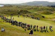 14 June 2006; The gallery watch Rory McIlroy, Holywood G.C., putt on the 11th green during the final round of the Irish Amateur Close Championship. European Club Golf Club, Brittas Bay, Co. Wicklow, Picture credit: Pat Murphy / SPORTSFILE
