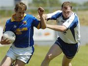 17 June 2006; Brian Kavanagh, Longford, in action against Shane Briggs, Waterford. Bank of Ireland All-Ireland Senior Football Championship Qualifier, Round 1, Waterford v Longford, Walsh Park, Waterford. Picture credit: Damien Eagers / SPORTSFILE