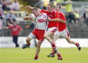 17 June 2006; Philip Loughran, Tyrone, in action against Christy Grimes, Louth. Bank of Ireland All-Ireland Senior Football Championship Qualifier, Round 1, Louth v Tyrone, Pairc Tailteann, Navan, Co. Meath. Picture credit: Brendan Moran / SPORTSFILE