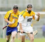 17 June 2006; Ciaran Herron, Antrim, in action against Gary Waldron, Roscommon. Christy Ring Cup, Round 2, Antrim v Roscommon, Casement Park, Belfast, Co. Antrim. Picture credit: Oliver McVeigh / SPORTSFILE