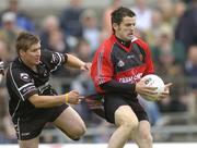 17 June 2006; Martin Cole, Down, in action against Karol O'Neill, Sligo. Bank of Ireland All-Ireland Senior Football Championship Qualifier, Round 1, Sligo v Down, Markievicz Park, Sligo. Picture credit: Pat Murphy / SPORTSFILE