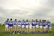 17 June 2006; The Laois team stand for a minutes silence in memory of Laois U21 player Jason Gilligan before the game. Guinness All-Ireland Senior Hurling Championship Qualifier, Round 1, Laois v Galway, O'Moore Park, Portlaoise, Co. Laois. Picture credit: Brian Lawless / SPORTSFILE
