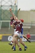 17 June 2006; Michael John Quinn, right, and Shane Kavanagh, Galway, in action against James Young, Laois. Guinness All-Ireland Senior Hurling Championship Qualifier, Round 1, Laois v Galway, O'Moore Park, Portlaoise, Co. Laois. Picture credit: Brian Lawless / SPORTSFILE