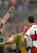 18 June 2006; Enda Muldoon, right, Derry, is shown the red card by referee Michael Monaghan. Bank of Ireland Ulster Senior Football Championship Semi-Final, Donegal v Derry, St. Tighearnach's Park, Clones, Co. Monaghan. Picture credit: Brendan Moran / SPORTSFILE