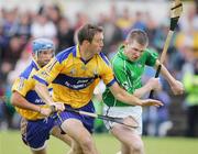 18 June 2006; Declan O'Roruke, Clare, in action against Mark Foley, Limerick. Guinness All-Ireland Senior Hurling Championship Qualifier, Round 1, Clare v Limerick, Cusack Park, Ennis, Co. Clare. Picture credit: Kieran Clancy / SPORTSFILE