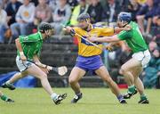 18 June 2006; Tony Carmody, Clare, in action against Brian Geary and Mark O'Riordan, Limerick. Guinness All-Ireland Senior Hurling Championship Qualifier, Round 1, Clare v Limerick, Cusack Park, Ennis, Co. Clare. Picture credit: Kieran Clancy / SPORTSFILE
