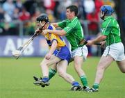 18 June 2006; Niall Gilligan, Clare, in action against Conor Fitzgerald and Damien Reale, Limerick. Guinness All-Ireland Senior Hurling Championship Qualifier, Round 1, Clare v Limerick, Cusack Park, Ennis, Co. Clare. Picture credit: Kieran Clancy / SPORTSFILE