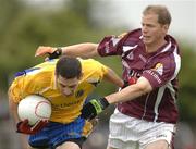 18 June 2006; Ger Henegan, Roscommon, in action against Michael Donnellan, Galway. Bank of Ireland Connacht Senior Football Championship Semi-Final, Roscommon v Galway, Dr. Hyde Park, Co. Roscommon. Picture credit: Ray McManus / SPORTSFILE