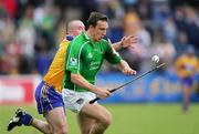 18 June 2006; Colin Lynch, Clare, in action against Ollie Moran, Limerick. Guinness All-Ireland Senior Hurling Championship Qualifier, Round 1, Clare v Limerick, Cusack Park, Ennis, Co. Clare. Picture credit: Kieran Clancy / SPORTSFILE