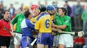 18 June 2006; Clare players Brian and Frank Lohan, David Fitzgerald and Sean McMahon, clash with Mike O'Brien, Limerick. Guinness All-Ireland Senior Hurling Championship Qualifier, Round 1, Clare v Limerick, Cusack Park, Ennis, Co. Clare. Picture credit: Kieran Clancy / SPORTSFILE