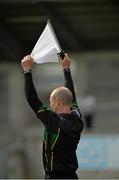 17 May 2014; A linesman looks for the attention of the referee. Electric Ireland Leinster Minor Football Championship, Quarter-Final, Dublin v Meath, Parnell Park, Dublin. Picture credit: Piaras Ó Mídheach / SPORTSFILE