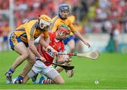 15 June 2014; Stephen McDonnell, Cork, in action against Conor McGrath, left, and Paraic Collins, Clare. Munster GAA Hurling Senior Championship, Semi-Final, Clare v Cork, Semple Stadium, Thurles, Co. Tipperary. Picture credit: Dáire Brennan / SPORTSFILE