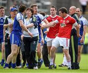 15 June 2014; Darren Hughes, left, Monaghan, and Conor Gormley, Tyrone, confront each other after the game. Ulster GAA Football Senior Championship, Semi-Final, Monaghan v Tyrone, St Tiernach's Park, Clones, Co. Monaghan. Picture credit: Brendan Moran / SPORTSFILE